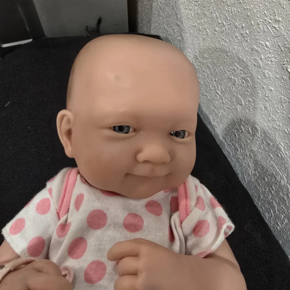 Adorable Baby Doll with Pink Polka Dot Outfit